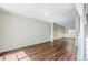 Spacious living area with hardwood floors, decorative columns, and plenty of natural light at 5011 Wewatta Sw St, Atlanta, GA 30331