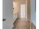 Bathroom with double vanity and shower with glass door at the end of the hall at 597 River Gardens Dr, Atlanta, GA 30354