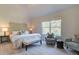 Bedroom featuring large windows, comfortable furniture and neutral tones at 597 River Gardens Dr, Atlanta, GA 30354