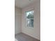 Walk-in closet featuring shelving for optimal storage solutions and a view of the backyard at 597 River Gardens Dr, Atlanta, GA 30354