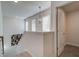 Hallway with neutral walls, modern light fixture, and white trim at 597 River Gardens Dr, Atlanta, GA 30354