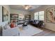 Living room with neutral walls, shelving, modern furnishings, and natural light from large windows at 597 River Gardens Dr, Atlanta, GA 30354