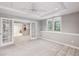 Finished basement featuring neutral carpet, recessed lighting, and french doors leading to another room at 12370 Preserve Ln, Johns Creek, GA 30005