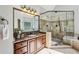 Beautiful bathroom features a glass shower, soaking tub, and granite countertop vanity at 12370 Preserve Ln, Johns Creek, GA 30005