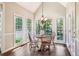 Sunlit breakfast nook with vaulted ceiling and large windows overlooking the backyard at 12370 Preserve Ln, Johns Creek, GA 30005