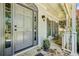 Inviting front entrance featuring a stone walkway, covered porch, and classic gray front door at 12370 Preserve Ln, Johns Creek, GA 30005