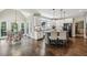 Bright and airy kitchen with white cabinets, granite countertops, and a breakfast nook with large windows at 12370 Preserve Ln, Johns Creek, GA 30005
