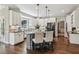 Bright kitchen features a large island, stainless steel appliances, and white cabinets at 12370 Preserve Ln, Johns Creek, GA 30005