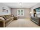 Living room featuring a sectional sofa, window, and TV on a media console at 12370 Preserve Ln, Johns Creek, GA 30005