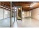 Spacious unfinished basement area with exposed ceiling beams and support columns at 2345 Leith Ave, Atlanta, GA 30344