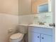 Compact bathroom with classic tile, toilet and vanity at 2345 Leith Ave, Atlanta, GA 30344
