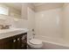 Tiled bathroom featuring a shower-tub combination, a sink with vanity, and a toilet at 2345 Leith Ave, Atlanta, GA 30344