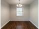 Empty dining room with hardwood floors and chandelier awaits your personal touch at 2345 Leith Ave, Atlanta, GA 30344