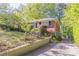 Brick house with a long driveway and landscaped yard is the perfect property for any buyer at 2345 Leith Ave, Atlanta, GA 30344
