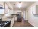 Renovated kitchen features stainless steel appliances, granite countertops, and tile backsplash for a luxurious feel at 2345 Leith Ave, Atlanta, GA 30344
