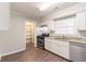 Well-lit kitchen features sleek appliances, granite countertops, and white cabinetry, perfect for cooking at 2345 Leith Ave, Atlanta, GA 30344
