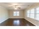 Cozy room with wood paneling, hardwood flooring, and bright windows at 2345 Leith Ave, Atlanta, GA 30344