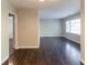Spacious living room features pristine hardwood floors with lots of sunlight and is ready for entertainment at 2345 Leith Ave, Atlanta, GA 30344