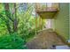 View of wooded backyard and deck from underneath, creating a peaceful outdoor setting at 3568 Oakshire Se Way, Atlanta, GA 30354