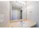 Bathroom with a single vanity, light fixture, and mirror, offering functionality and style at 3568 Oakshire Se Way, Atlanta, GA 30354