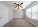 Bedroom featuring neutral paint, carpet, ceiling fan, and a window at 3568 Oakshire Se Way, Atlanta, GA 30354