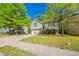 Charming home featuring a well-maintained lawn, two-car garage, and inviting entryway at 3568 Oakshire Se Way, Atlanta, GA 30354