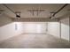 Spacious two-car garage with concrete floors and ample room for parking and storage at 3568 Oakshire Se Way, Atlanta, GA 30354