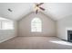 Spacious living room with vaulted ceilings, a fireplace, and abundant natural light at 3568 Oakshire Se Way, Atlanta, GA 30354