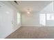 Living room featuring neutral paint, carpet and a door to the front of the house at 3568 Oakshire Se Way, Atlanta, GA 30354