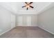 Spacious main bedroom with a ceiling fan, neutral paint, carpet and tray ceiling at 3568 Oakshire Se Way, Atlanta, GA 30354