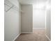 Walk-in closet featuring neutral paint, carpet, and wire shelving at 3568 Oakshire Se Way, Atlanta, GA 30354