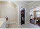 A bathroom leads to the main bedroom and walk-in closet for convenience and privacy at 4265 Prince Charles Dr, Duluth, GA 30097