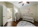 Charming Bedroom/bedroom with light-toned furniture, an elephant-themed rug, and a lovely mural at 4265 Prince Charles Dr, Duluth, GA 30097