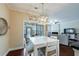 Eat-in kitchen and dining area featuring white table set and views of the living room at 4265 Prince Charles Dr, Duluth, GA 30097