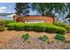 Attractive Windsor Court neighborhood sign surrounded by shrubs and greenery at 4265 Prince Charles Dr, Duluth, GA 30097