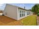 The rear exterior features low-maintenance vinyl siding, an irrigation system, and a manicured lawn at 4265 Prince Charles Dr, Duluth, GA 30097