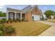 Beautiful home with a two-car garage, manicured lawn, and lovely landscaping at 4265 Prince Charles Dr, Duluth, GA 30097