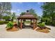 A beautifully landscaped community gazebo offers a scenic relaxing spot at 4265 Prince Charles Dr, Duluth, GA 30097