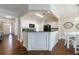 Bright eat-in kitchen with white cabinets, black appliances, and dark countertops at 4265 Prince Charles Dr, Duluth, GA 30097