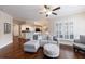 Bright open concept living room connected to kitchen with hardwood floors and neutral tones at 4265 Prince Charles Dr, Duluth, GA 30097