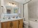 Bright bathroom with a double sink vanity, sleek modern fixtures, and a stylish lighted mirror at 745 Abbotts Mill Ct, Johns Creek, GA 30097