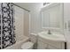 Functional bathroom with a tub, toilet, and a sink with chrome faucet at 745 Abbotts Mill Ct, Johns Creek, GA 30097