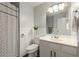 Cozy bathroom with floral shower curtain, tiled walls, and neutral fixtures at 745 Abbotts Mill Ct, Johns Creek, GA 30097