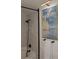 Well-lit bathroom featuring a framed print, a shower with a black frame, and matching towel racks at 745 Abbotts Mill Ct, Johns Creek, GA 30097