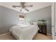 Comfortable bedroom featuring natural light, ceiling fan, and a charming fish tank at 745 Abbotts Mill Ct, Johns Creek, GA 30097