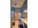 Bright bathroom with modern fixtures, barn door, and vanity at 1235 Jasmine Green Ct, Dacula, GA 30019