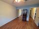 This bedroom has hardwood floors and access to other rooms at 1235 Jasmine Green Ct, Dacula, GA 30019