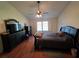 Cozy bedroom with a ceiling fan and a large bed at 1235 Jasmine Green Ct, Dacula, GA 30019