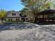 Exterior of community clubhouse with adjacent picnic pavilion and paved parking area at 1235 Jasmine Green Ct, Dacula, GA 30019