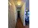 Hallway with hardwood floors connecting various rooms at 1235 Jasmine Green Ct, Dacula, GA 30019